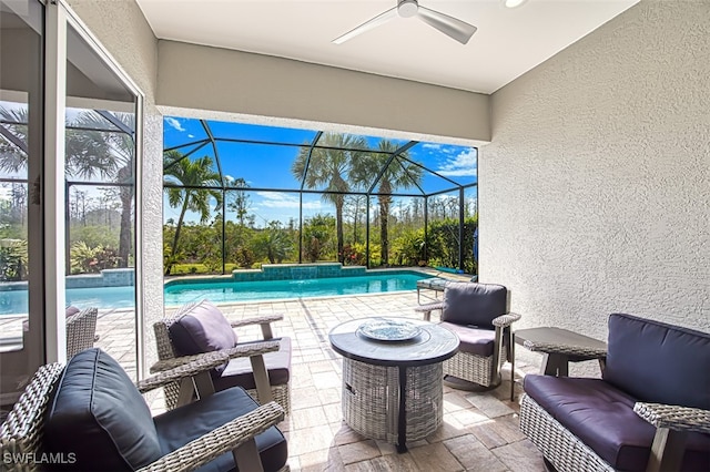 view of patio / terrace featuring an outdoor pool, glass enclosure, ceiling fan, and an outdoor living space