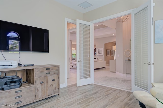 office area featuring light wood-style floors, recessed lighting, french doors, and baseboards