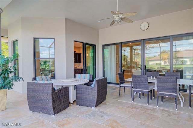 view of patio featuring ceiling fan and outdoor dining area