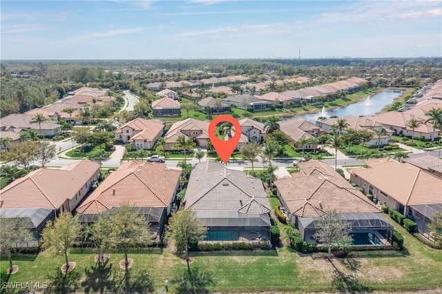 aerial view featuring a water view and a residential view