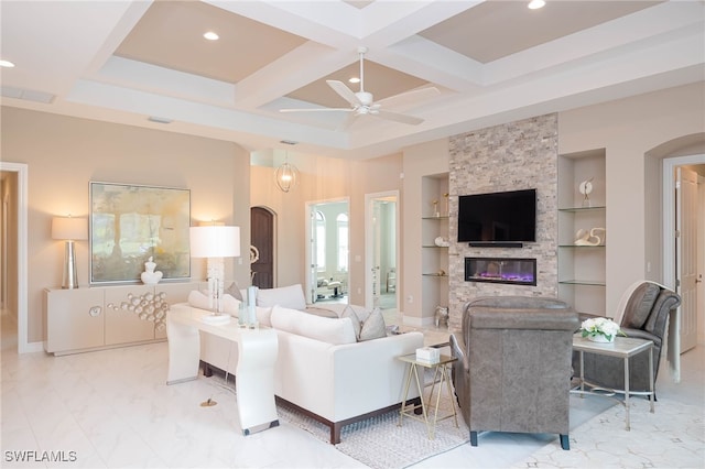 living room with built in features, coffered ceiling, ceiling fan, a fireplace, and recessed lighting