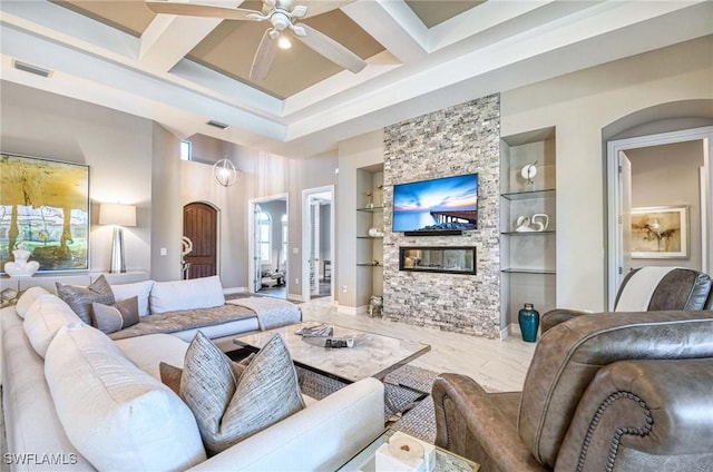 living room featuring built in features, a fireplace, visible vents, and coffered ceiling