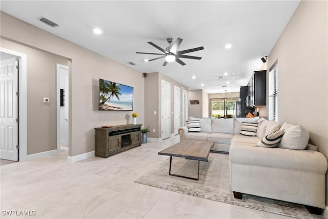 living room with baseboards, visible vents, ceiling fan, and recessed lighting