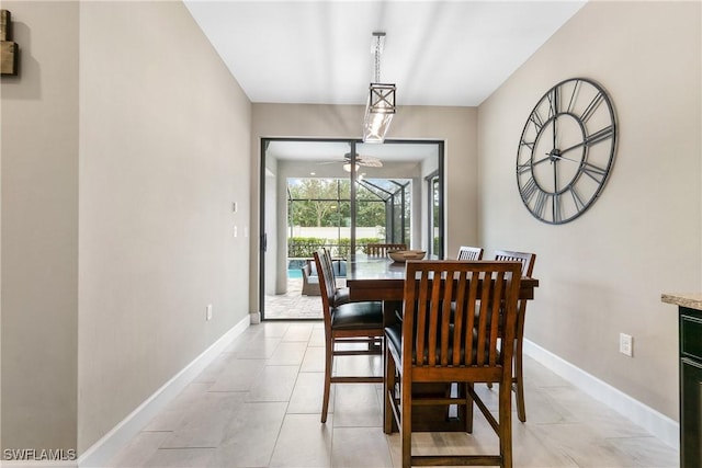 dining area featuring baseboards and light tile patterned floors