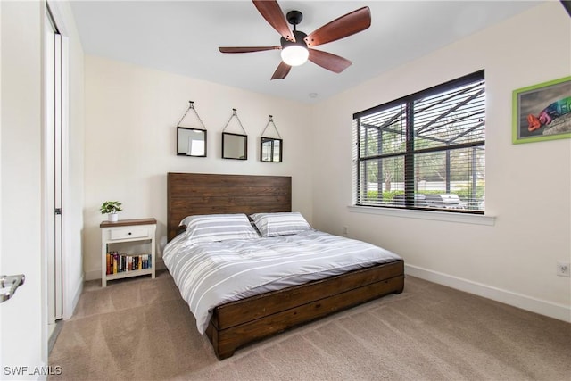 bedroom featuring carpet floors, ceiling fan, and baseboards