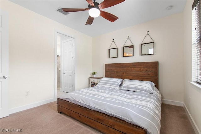 carpeted bedroom featuring visible vents, ceiling fan, and baseboards