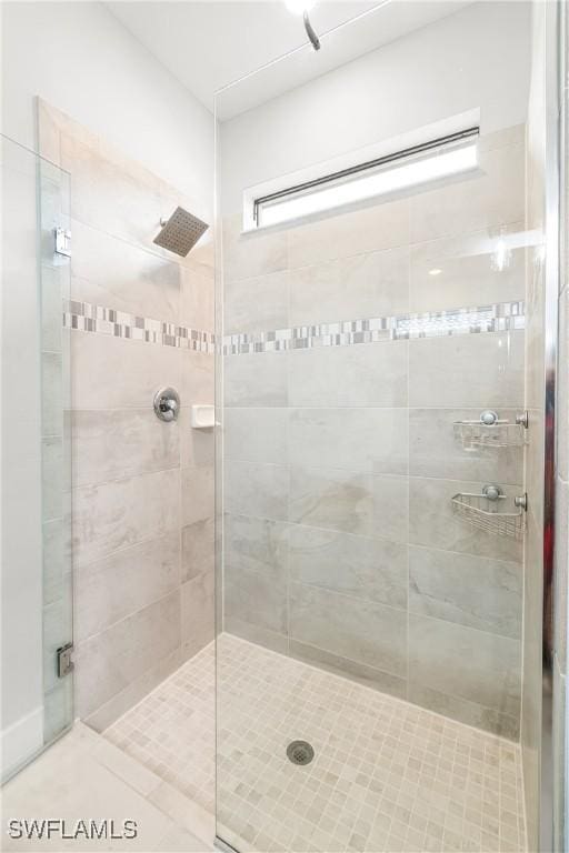 bathroom featuring a shower stall