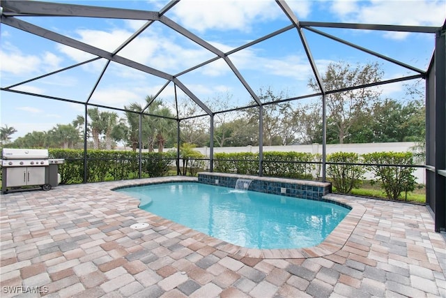 outdoor pool with a lanai, a patio, and grilling area