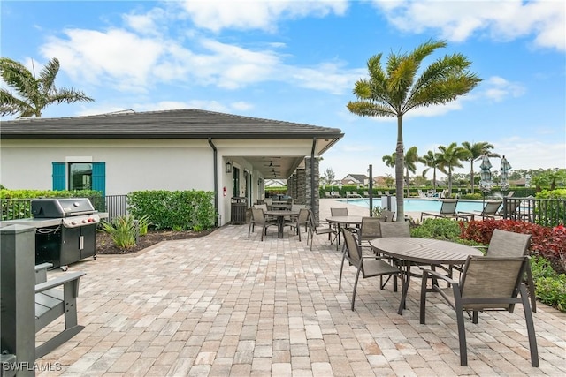 view of patio featuring a grill and a community pool