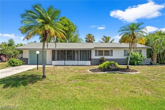 ranch-style home with an attached garage, a sunroom, concrete driveway, stucco siding, and a front lawn