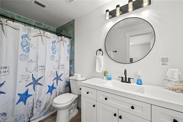 full bath featuring visible vents, toilet, wood finished floors, curtained shower, and vanity