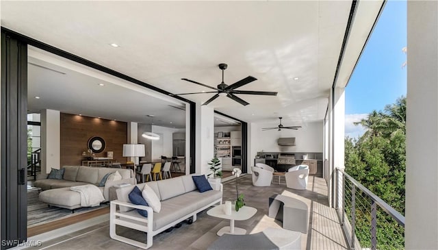 living room featuring a ceiling fan and floor to ceiling windows