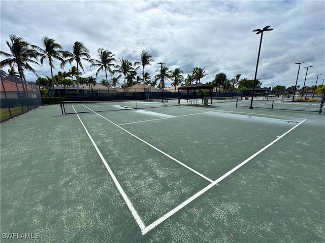 view of sport court with fence