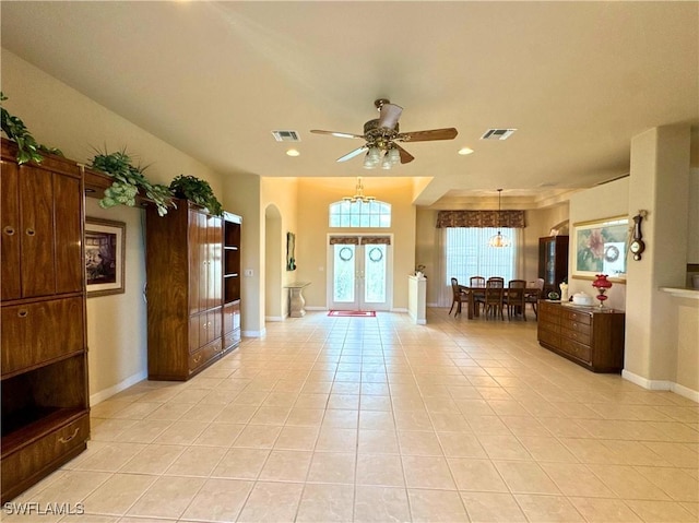 entrance foyer with french doors, visible vents, baseboards, and light tile patterned flooring