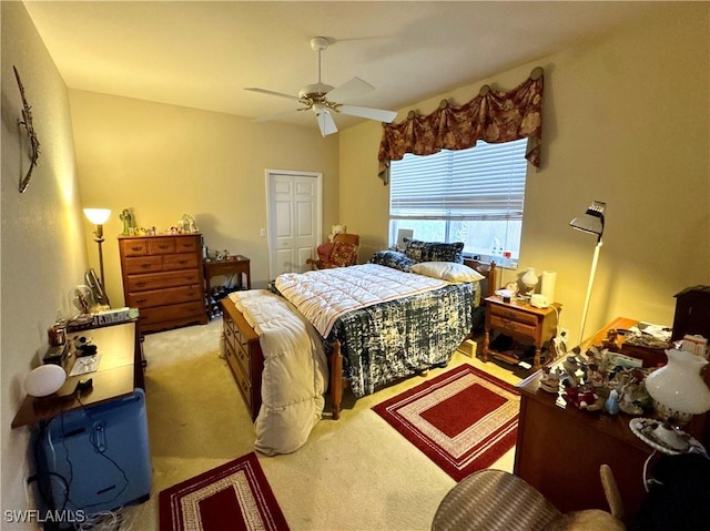 bedroom featuring carpet floors, a closet, and ceiling fan