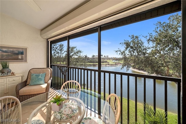 sunroom with a water view