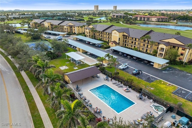 birds eye view of property featuring a water view and a residential view