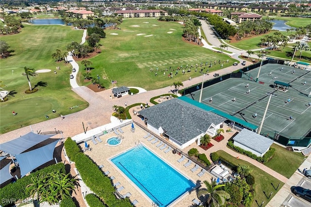 aerial view featuring a water view and golf course view