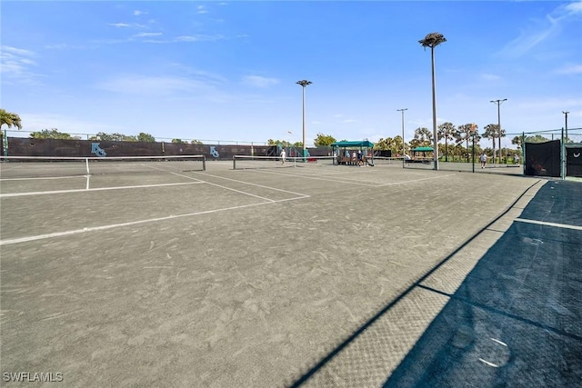 view of tennis court with fence