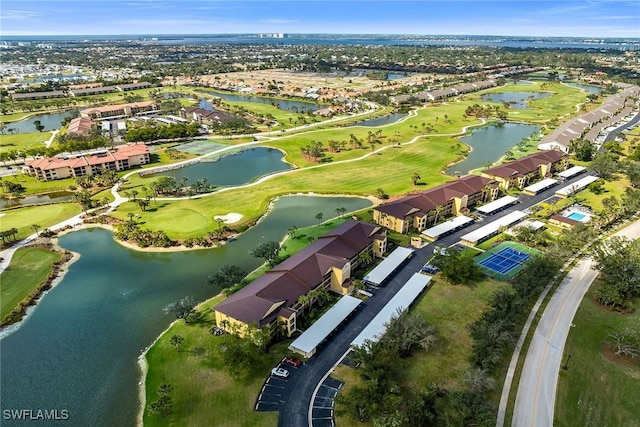 birds eye view of property featuring a residential view, view of golf course, and a water view