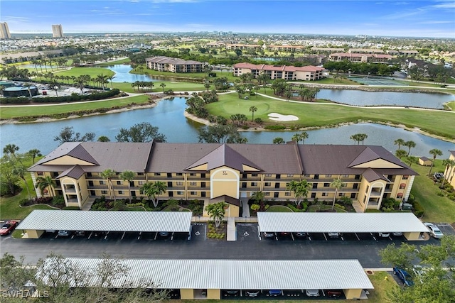 aerial view featuring a water view and golf course view