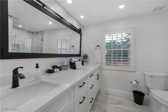 full bathroom featuring baseboards, visible vents, toilet, marble finish floor, and a sink