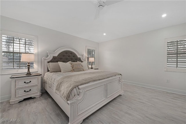 bedroom featuring light wood-style floors, recessed lighting, and baseboards