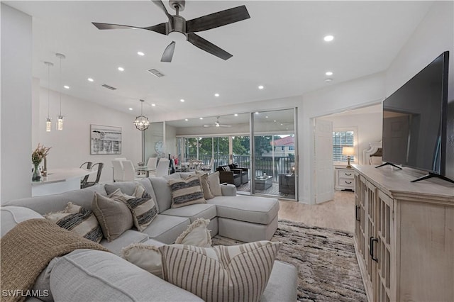 living room featuring ceiling fan, recessed lighting, visible vents, and light wood-style floors