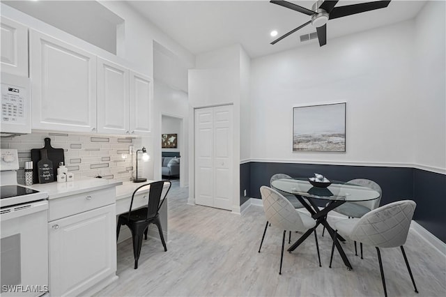 dining space featuring light wood-style flooring, recessed lighting, visible vents, baseboards, and a ceiling fan