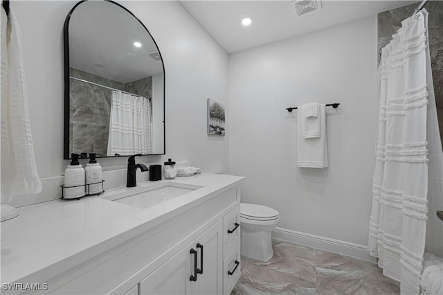 bathroom with marble finish floor, visible vents, toilet, vanity, and baseboards