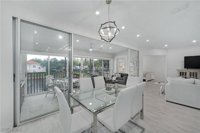 dining space featuring ceiling fan with notable chandelier, visible vents, and recessed lighting