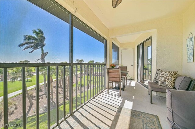 balcony featuring a sunroom