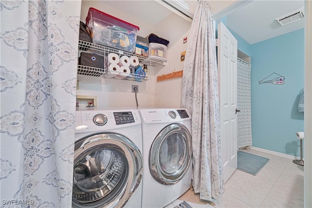 washroom with laundry area, visible vents, baseboards, independent washer and dryer, and tile patterned floors