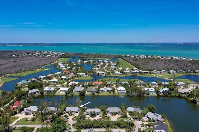 bird's eye view with a residential view and a water view