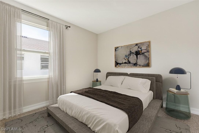 bedroom featuring baseboards