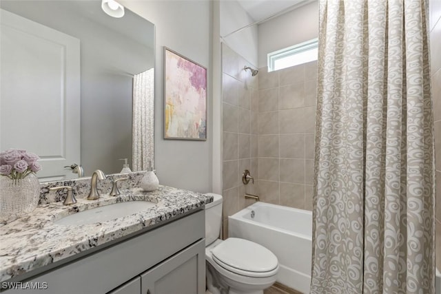 bathroom featuring toilet, shower / bath combination with curtain, and vanity