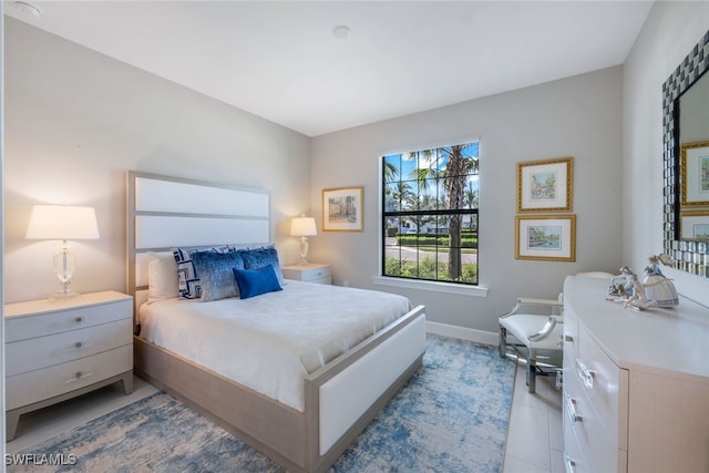 tiled bedroom with baseboards