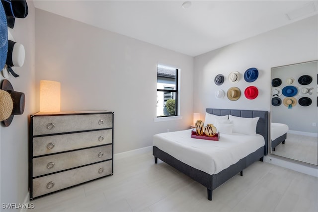 bedroom featuring visible vents and baseboards