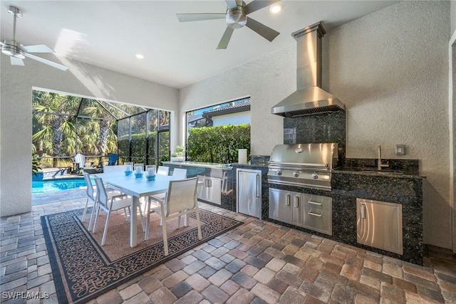 view of patio / terrace with an outdoor pool, an outdoor kitchen, a ceiling fan, glass enclosure, and a grill