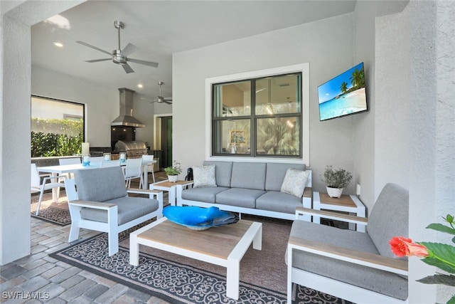 view of patio with ceiling fan, outdoor dining space, and an outdoor living space