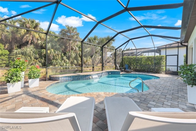 pool featuring a lanai and a patio area