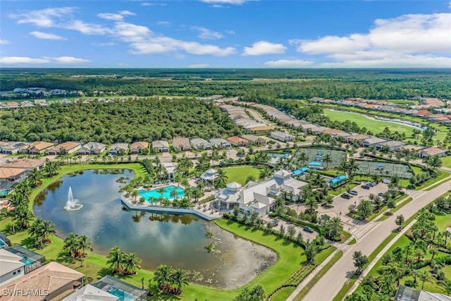 drone / aerial view featuring a residential view and a water view