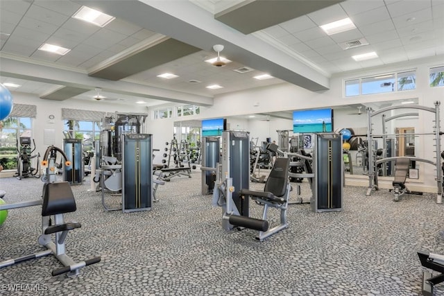 workout area with visible vents, a drop ceiling, and crown molding