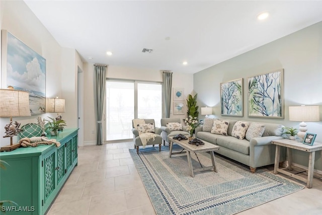 living room featuring light tile patterned floors, baseboards, visible vents, and recessed lighting