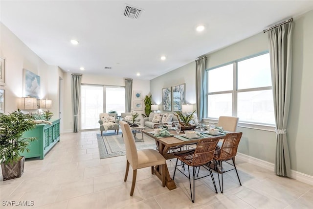 dining area with light tile patterned floors, baseboards, visible vents, and recessed lighting