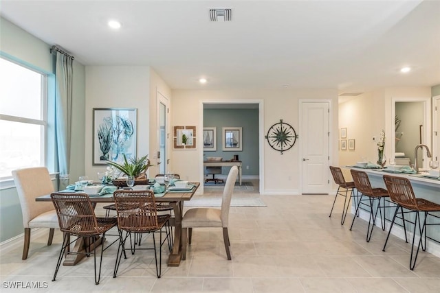 dining room with light tile patterned flooring, visible vents, baseboards, and recessed lighting