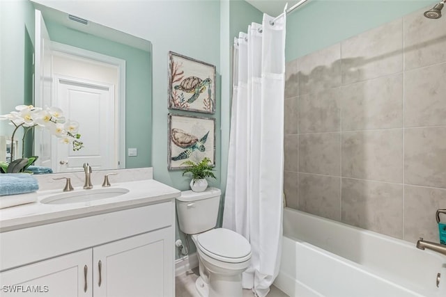 bathroom featuring toilet, visible vents, shower / bath combo with shower curtain, and vanity