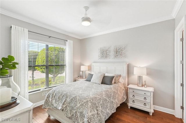 bedroom featuring crown molding, baseboards, ceiling fan, and dark wood-style flooring