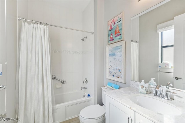 bathroom featuring vanity, toilet, and shower / bathtub combination with curtain