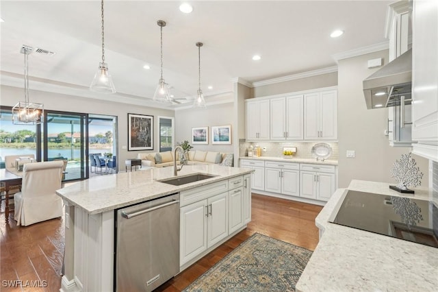 kitchen with an island with sink, dark wood-style flooring, stainless steel dishwasher, white cabinetry, and a sink